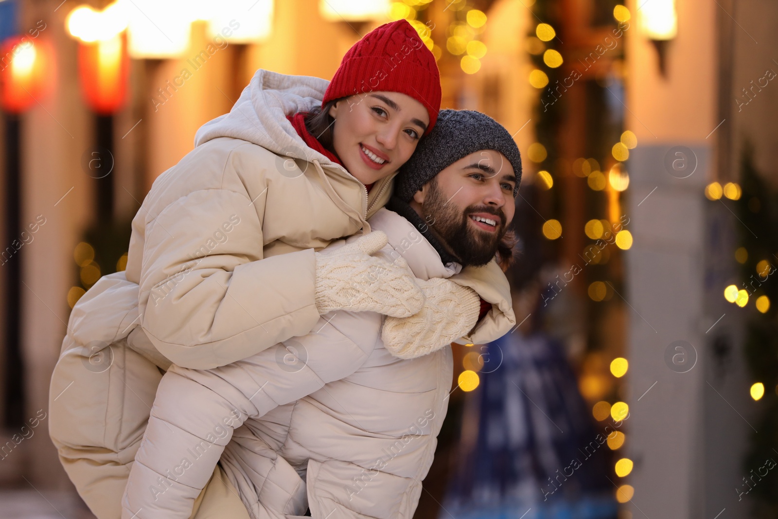 Photo of Lovely couple spending time together on city street