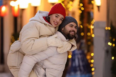 Photo of Lovely couple spending time together on city street