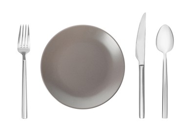 Empty grey plate with fork, knife and spoon on white background, top view