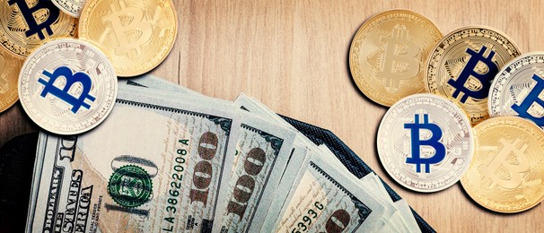 Image of Bitcoins, dollar banknotes and wallet on wooden background, flat lay. Banner design