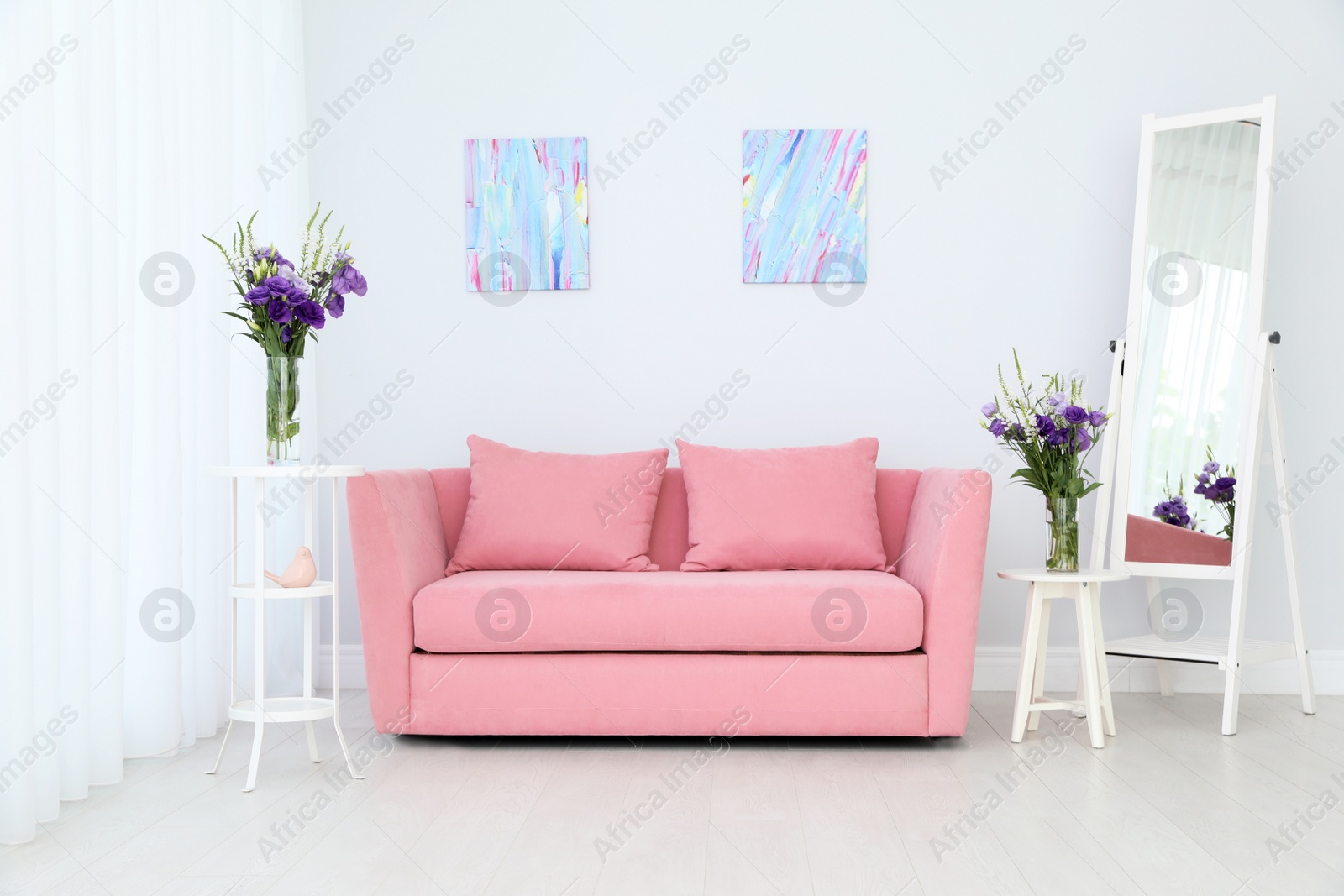 Photo of Modern interior of living room with comfortable sofa near white wall