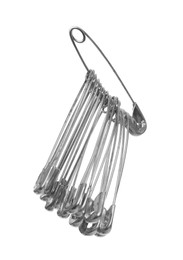 New metal safety pins on white background