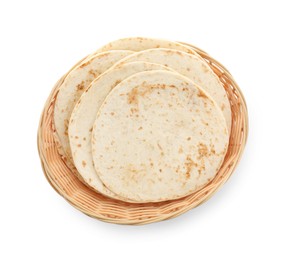 Photo of Tasty homemade tortillas in wicker basket isolated on white, top view