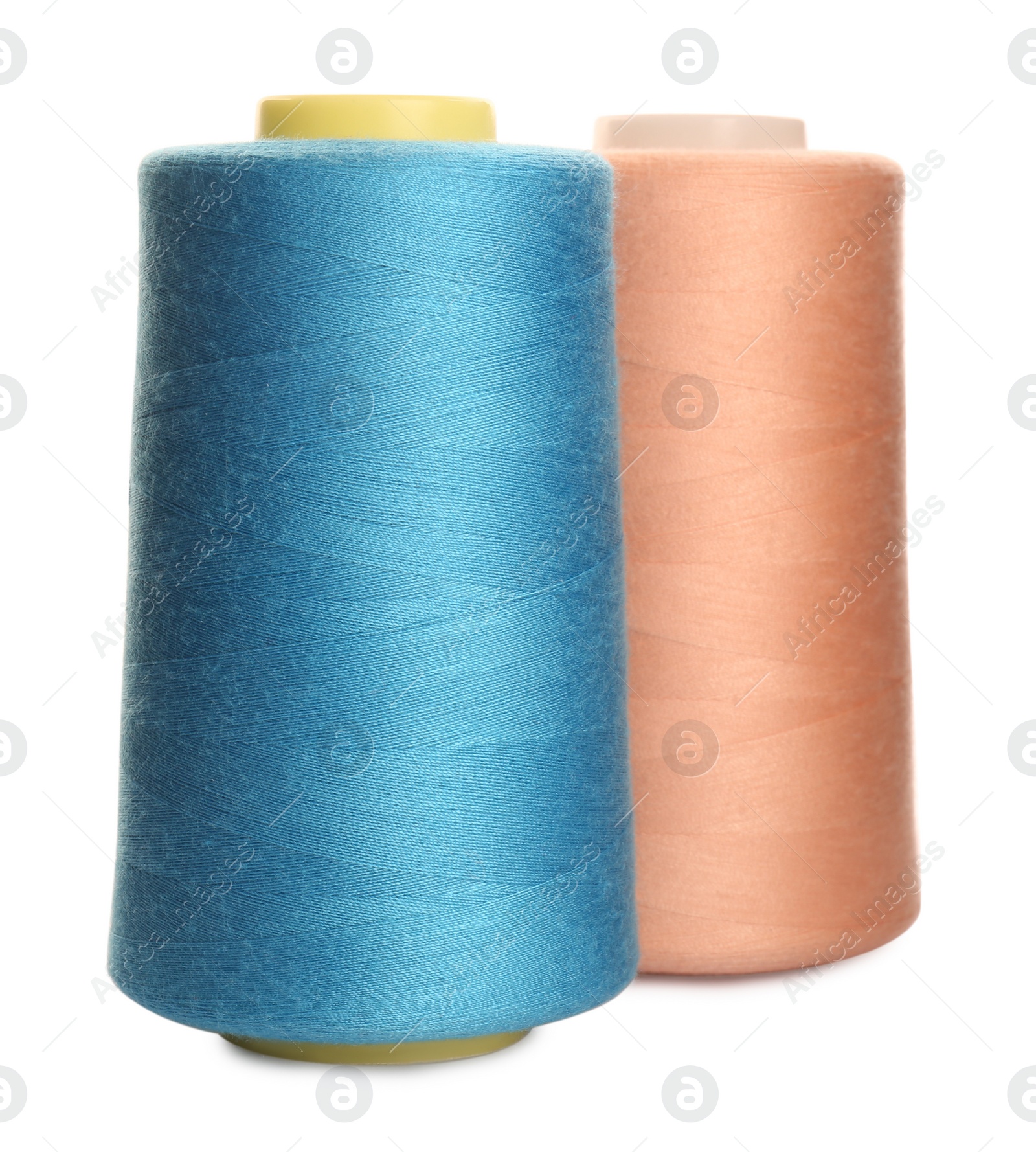 Photo of Different colorful sewing threads on white background