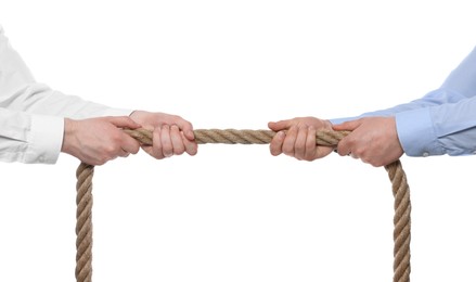 Photo of Dispute concept. Men pulling rope on white background, closeup