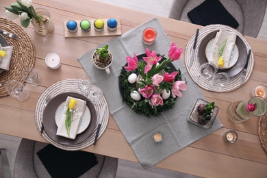 Photo of Beautiful Easter table setting with beautiful flowers indoors, flat lay