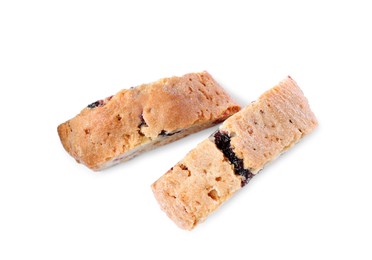 Photo of Slices of tasty cantucci with berry on white background, top view. Traditional Italian almond biscuits