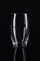 Photo of New empty tall glass on black background