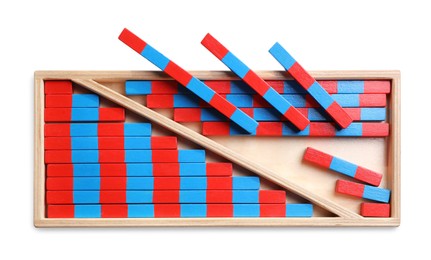 Photo of Wooden box with red and blue numerical sticks isolated on white, top view. Montessori math toy