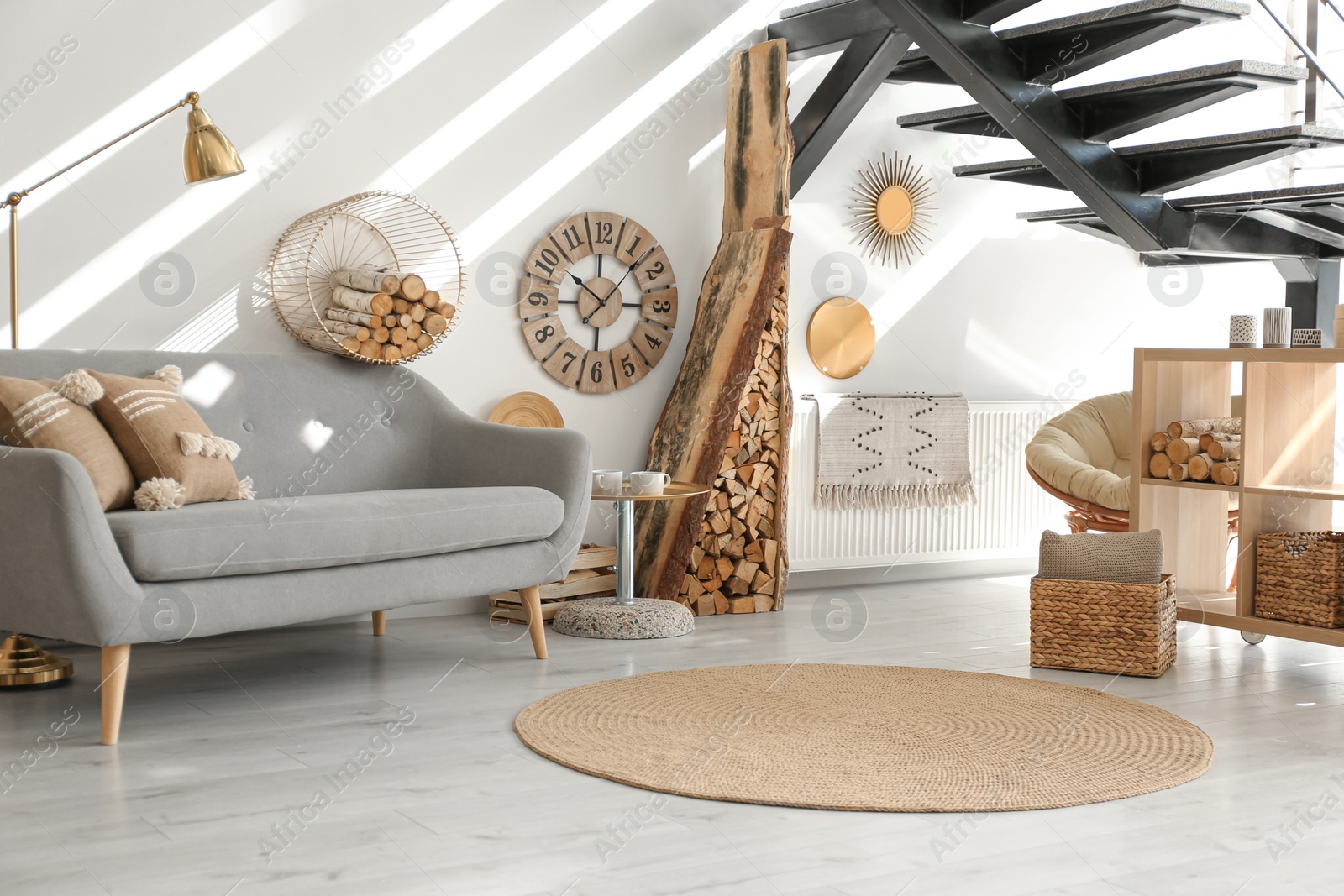 Photo of Stylish room interior with firewood as decorative element