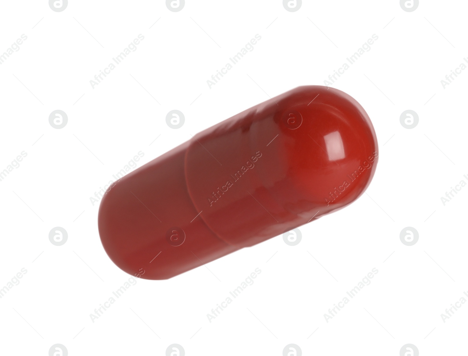 Photo of One red pill on white background. Medicinal treatment