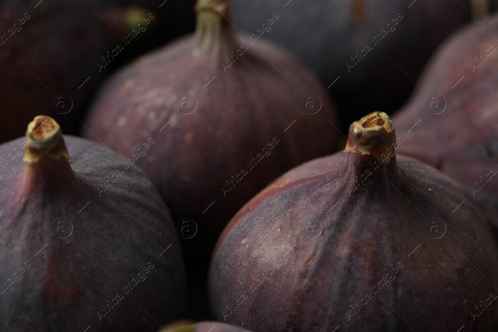 Photo of Tasty fresh figs as background, closeup view