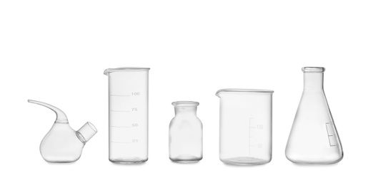 Photo of Clean empty laboratory glassware isolated on white