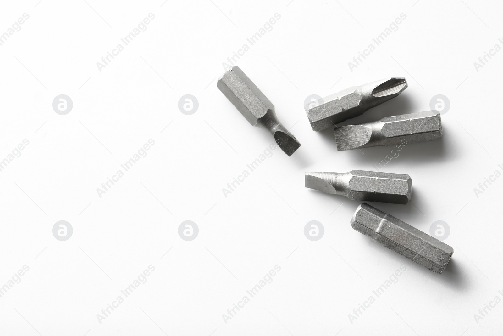 Photo of Different screwdriver bits on white background, top view