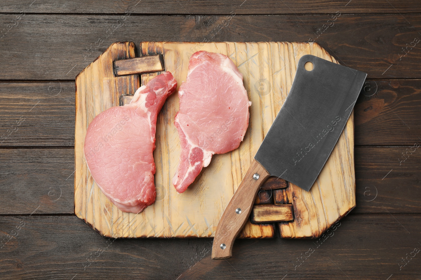 Photo of Flat lay composition with fresh raw cut meat on wooden table