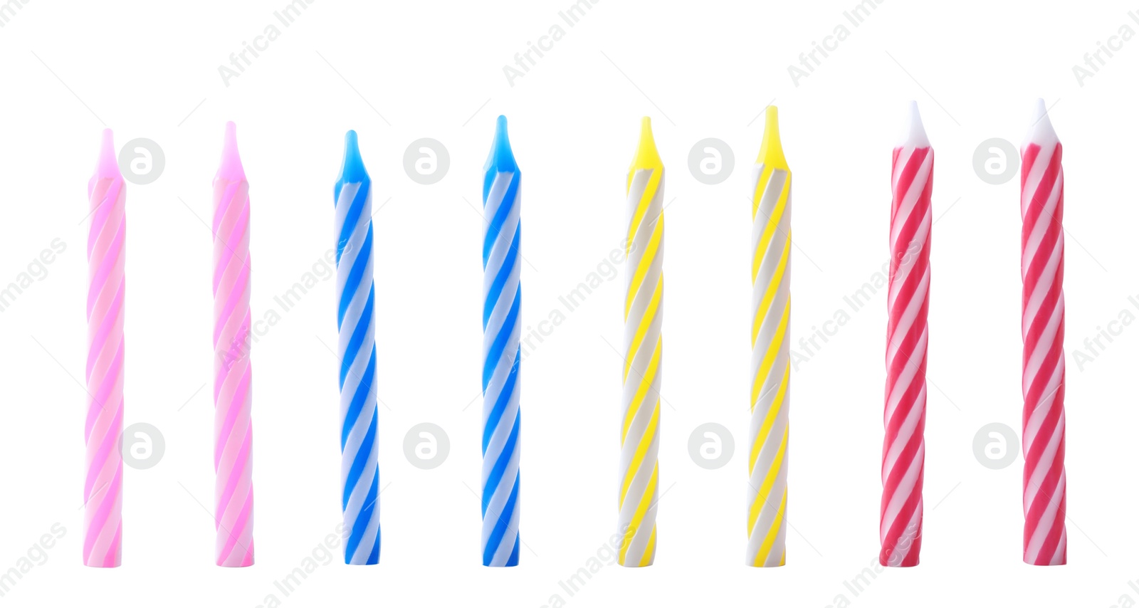 Photo of Set of colorful striped birthday candles isolated on white