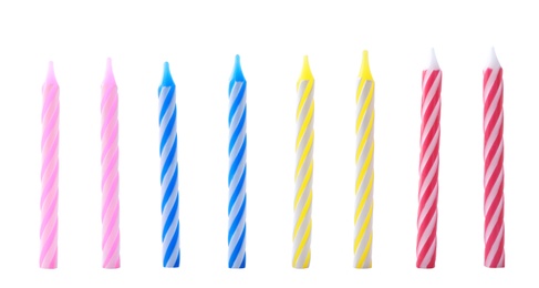 Photo of Set of colorful striped birthday candles isolated on white