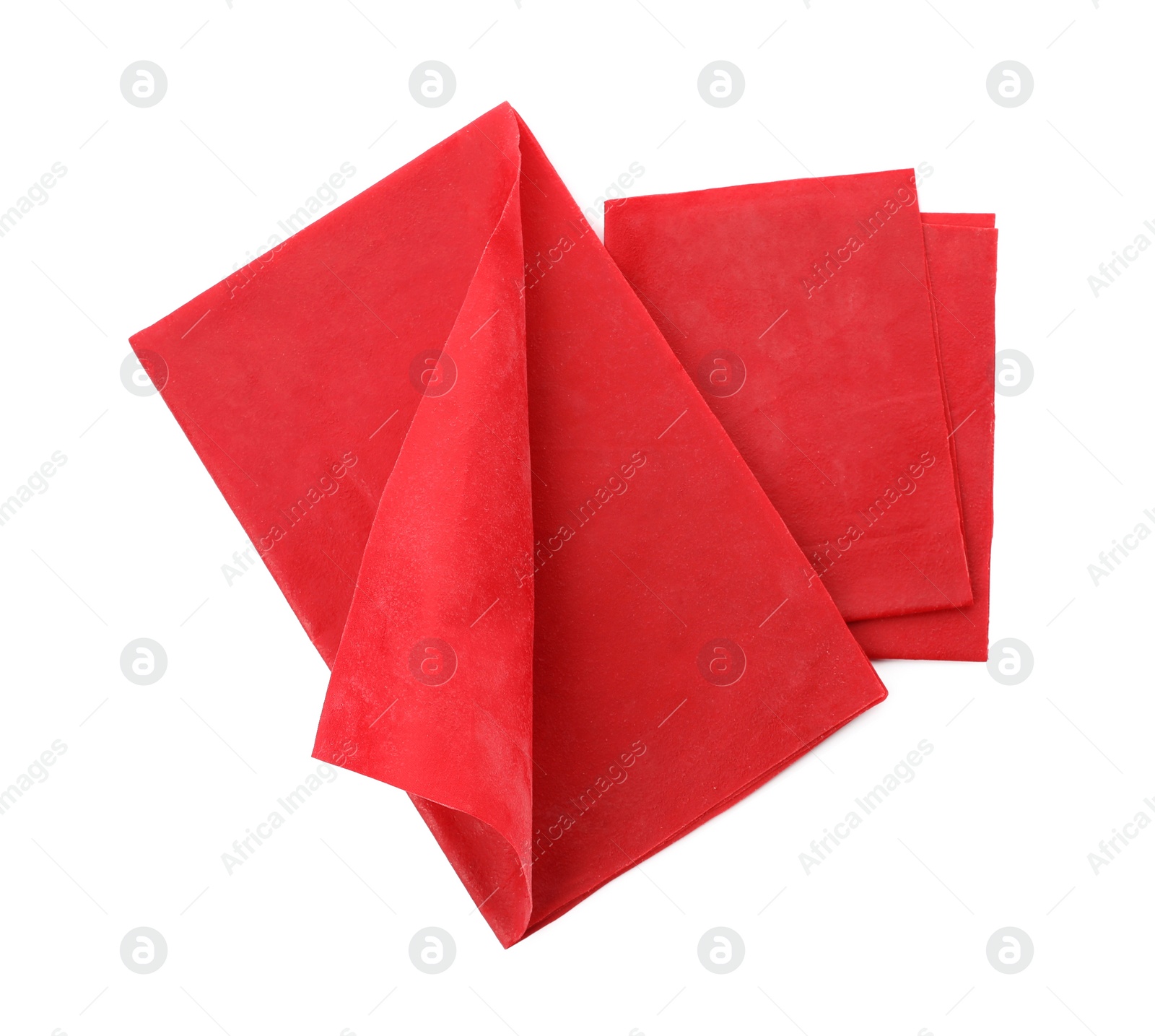 Photo of Red reusable beeswax food wraps on white background, top view