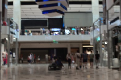 Blurred view of big shopping mall with many stores