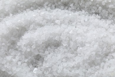 Photo of White natural salt as background, top view