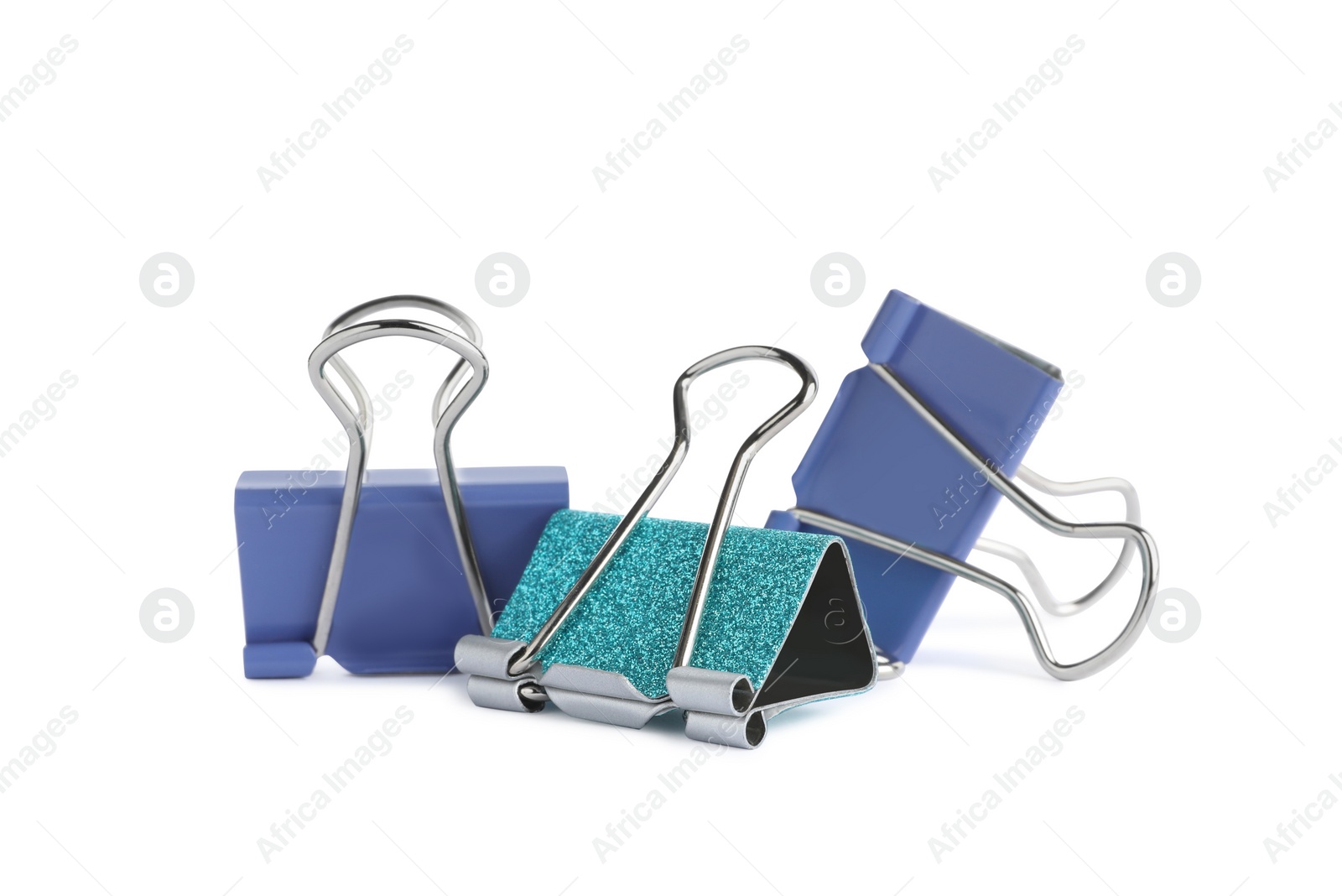 Photo of Colorful binder clips on white background. Stationery item