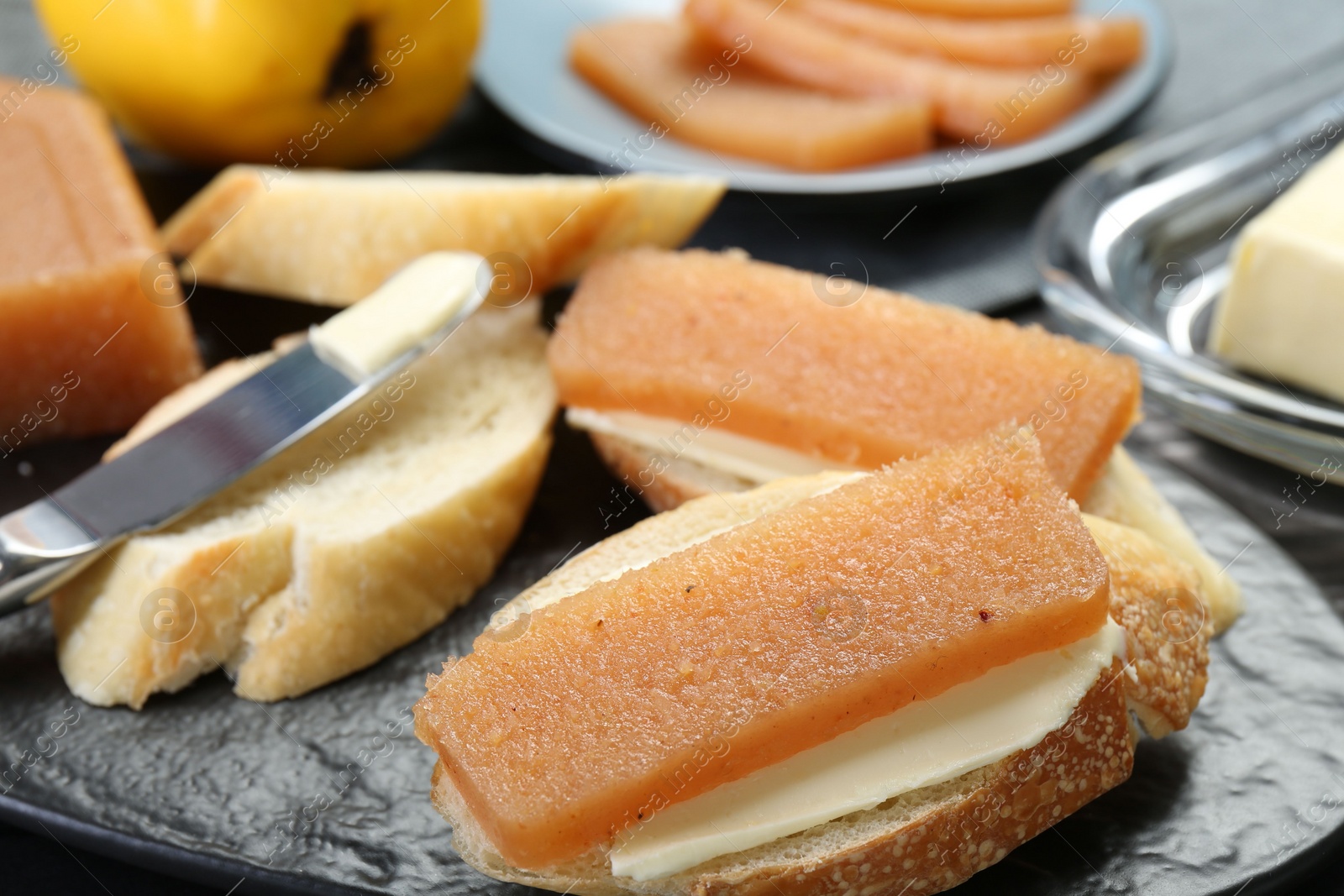Photo of Tasty sandwiches with quince paste on table, closeup