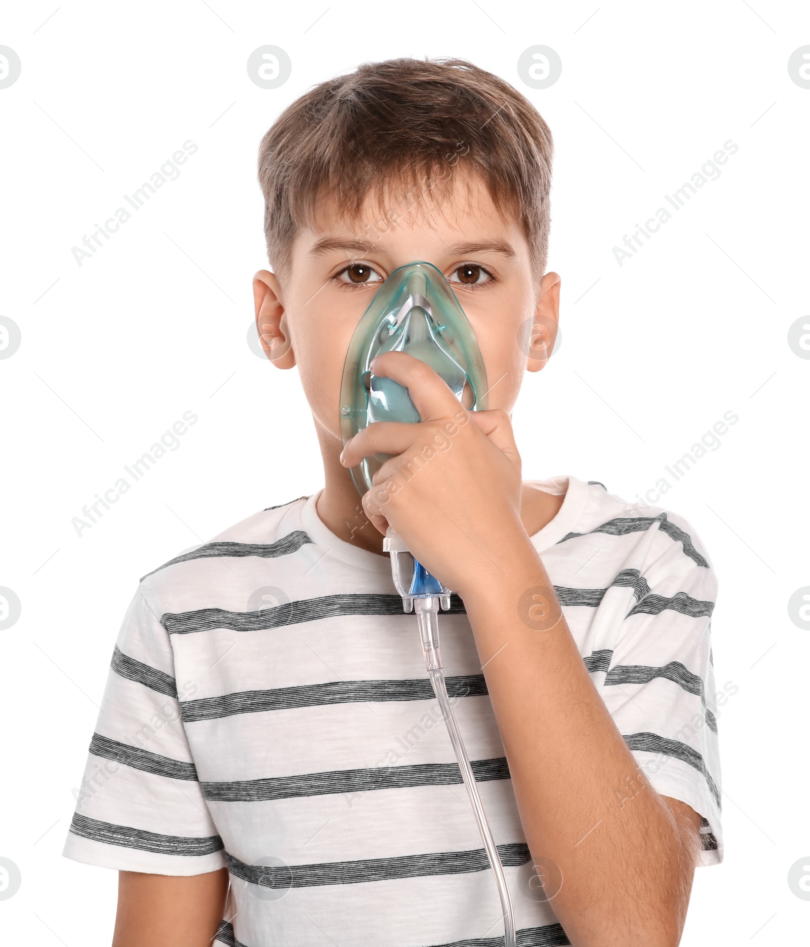 Photo of Boy using nebulizer for inhalation on white background