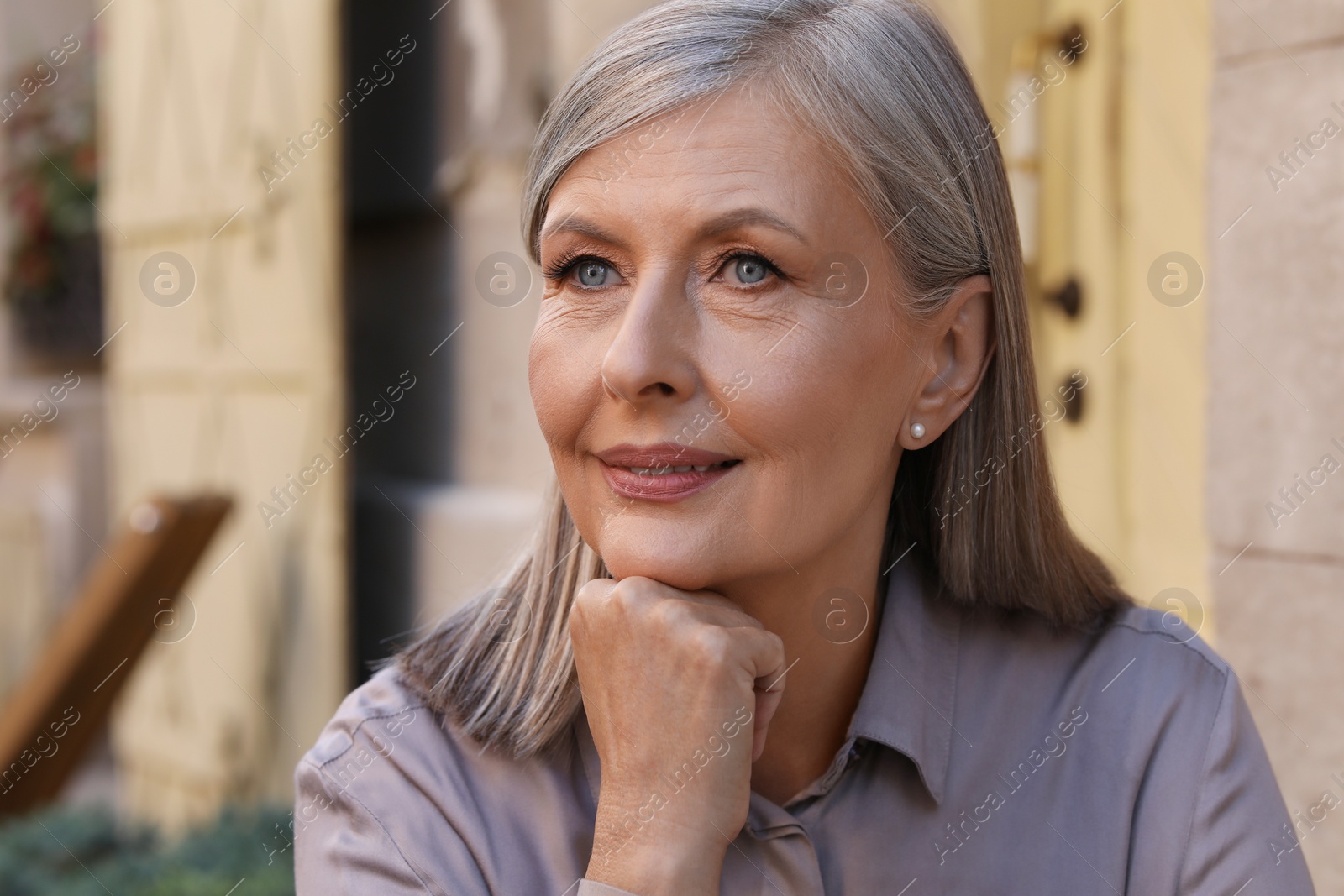Photo of Portrait of beautiful smiling senior woman outdoors