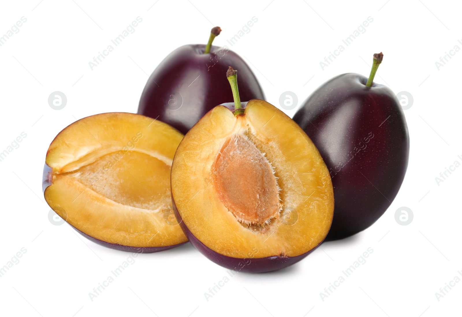 Photo of Whole and cut ripe plums on white background