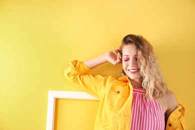 Beautiful young woman posing on color background. Summer fashion