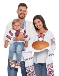 Photo of Happy Ukrainian family in embroidered shirts with korovai bread on white background
