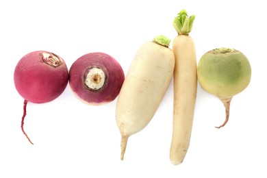 Different ripe turnips on white background, top view