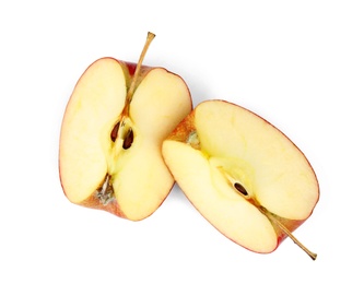 Pieces of ripe juicy red apple on white background, top view