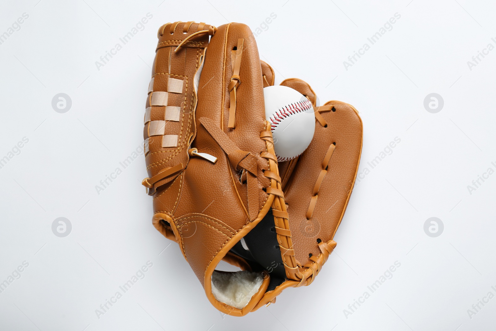 Photo of Catcher's mitt and baseball ball on white background, top view. Sports game