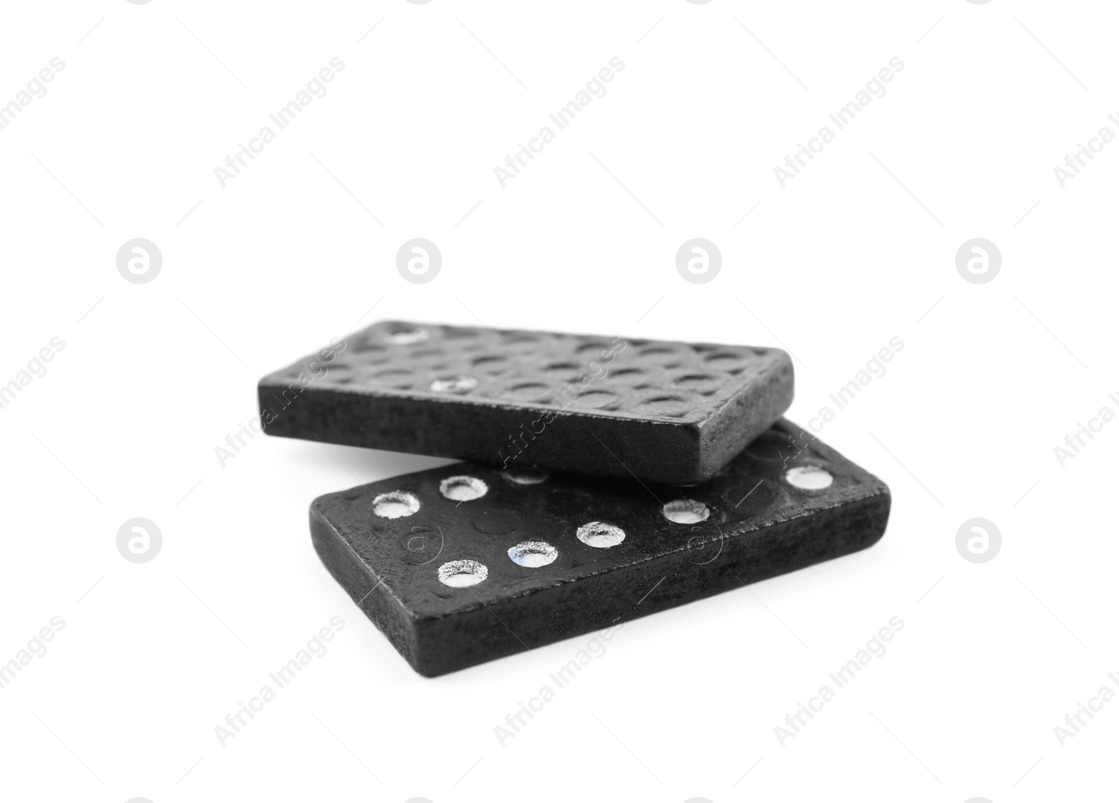 Photo of Two black domino tiles on white background