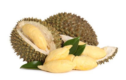 Photo of Fresh ripe durians with green leaves on white background. Tropical fruit