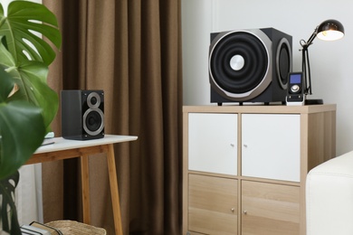 Modern powerful audio speaker system in bright room