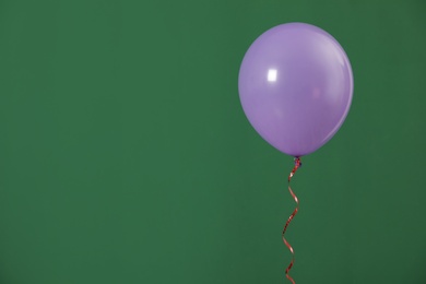 Photo of Bright balloon on color background, space for text. Celebration time