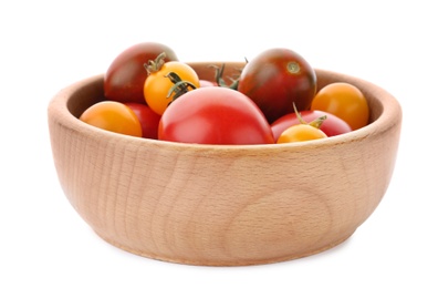 Photo of Ripe red and yellow tomatoes in wooden bowl on white background