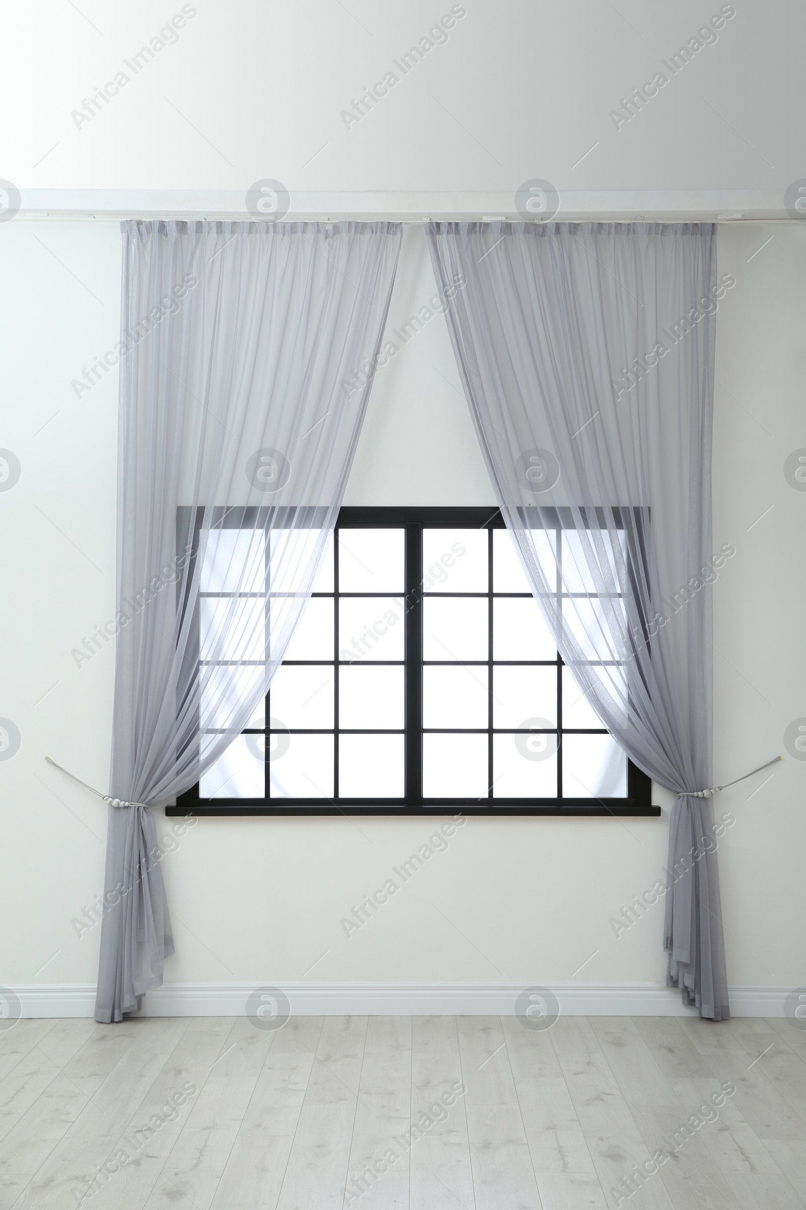 Photo of Modern window with curtains in room. Home interior