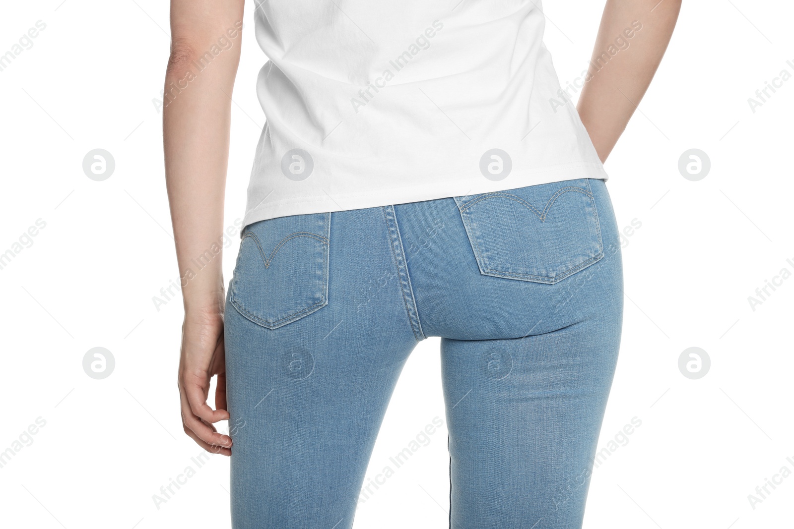 Photo of Woman wearing stylish light blue jeans on white background, closeup