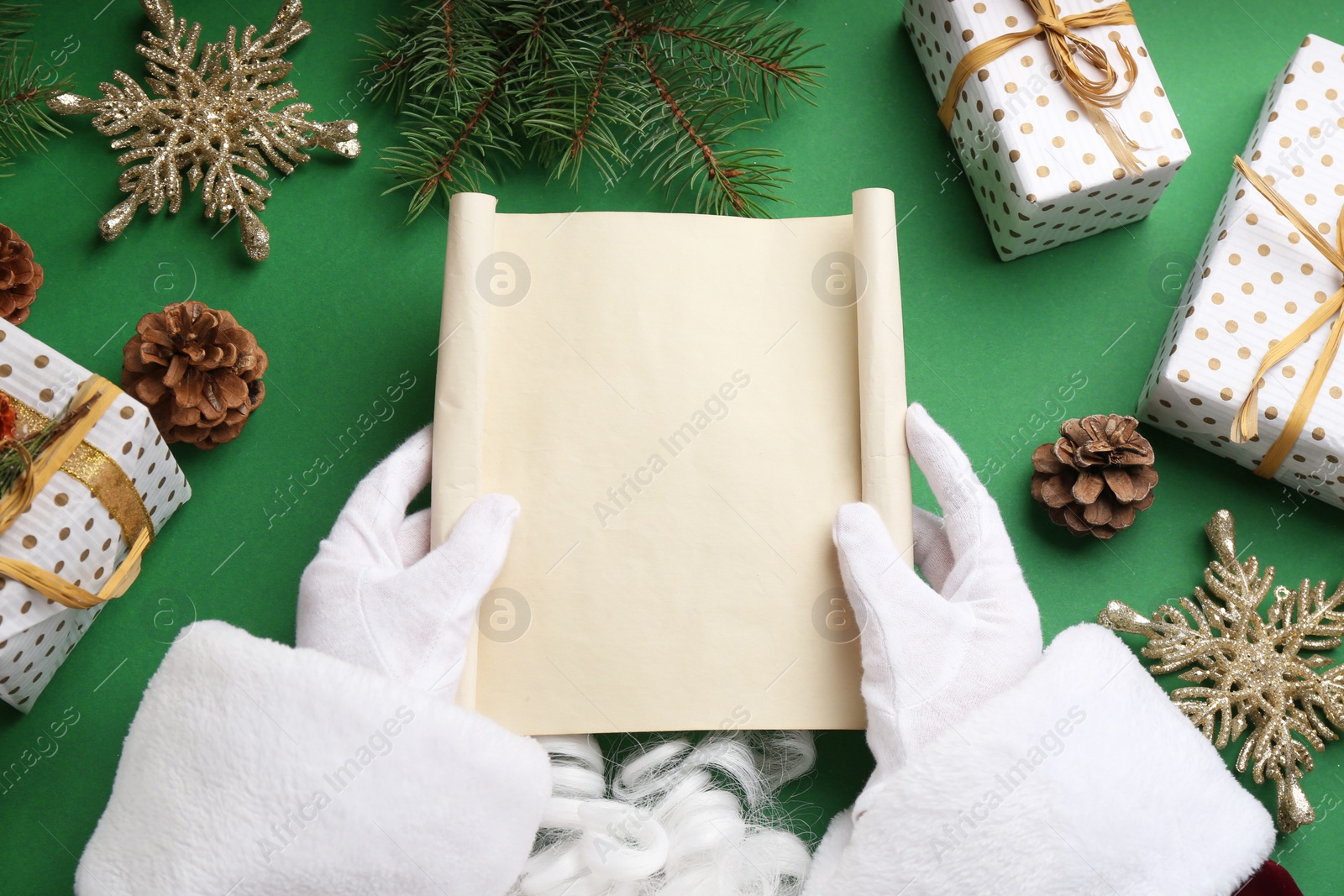 Photo of Santa with letter at green table, top view