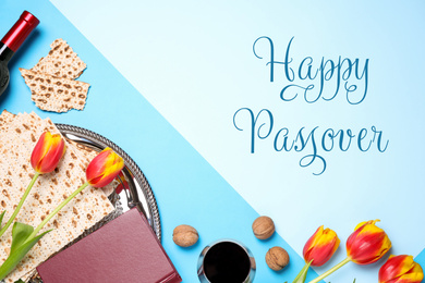 Image of Flat lay composition with symbolic Pesach (Passover Seder) items on blue background,