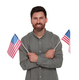 Image of 4th of July - Independence day of America. Happy man holding national flags of United States on white background