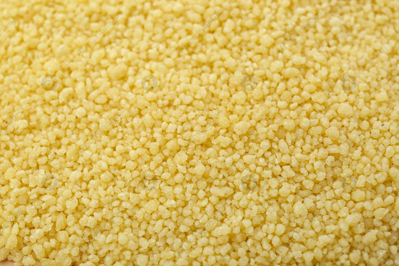 Photo of Closeup view of raw couscous as background