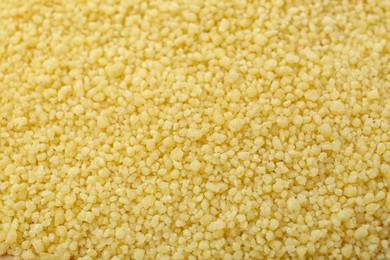 Photo of Closeup view of raw couscous as background