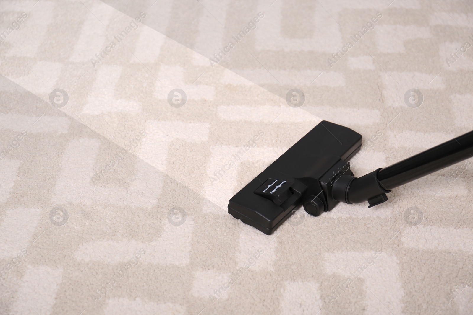 Image of Vacuuming dirty carpet. Clean area after using device, closeup