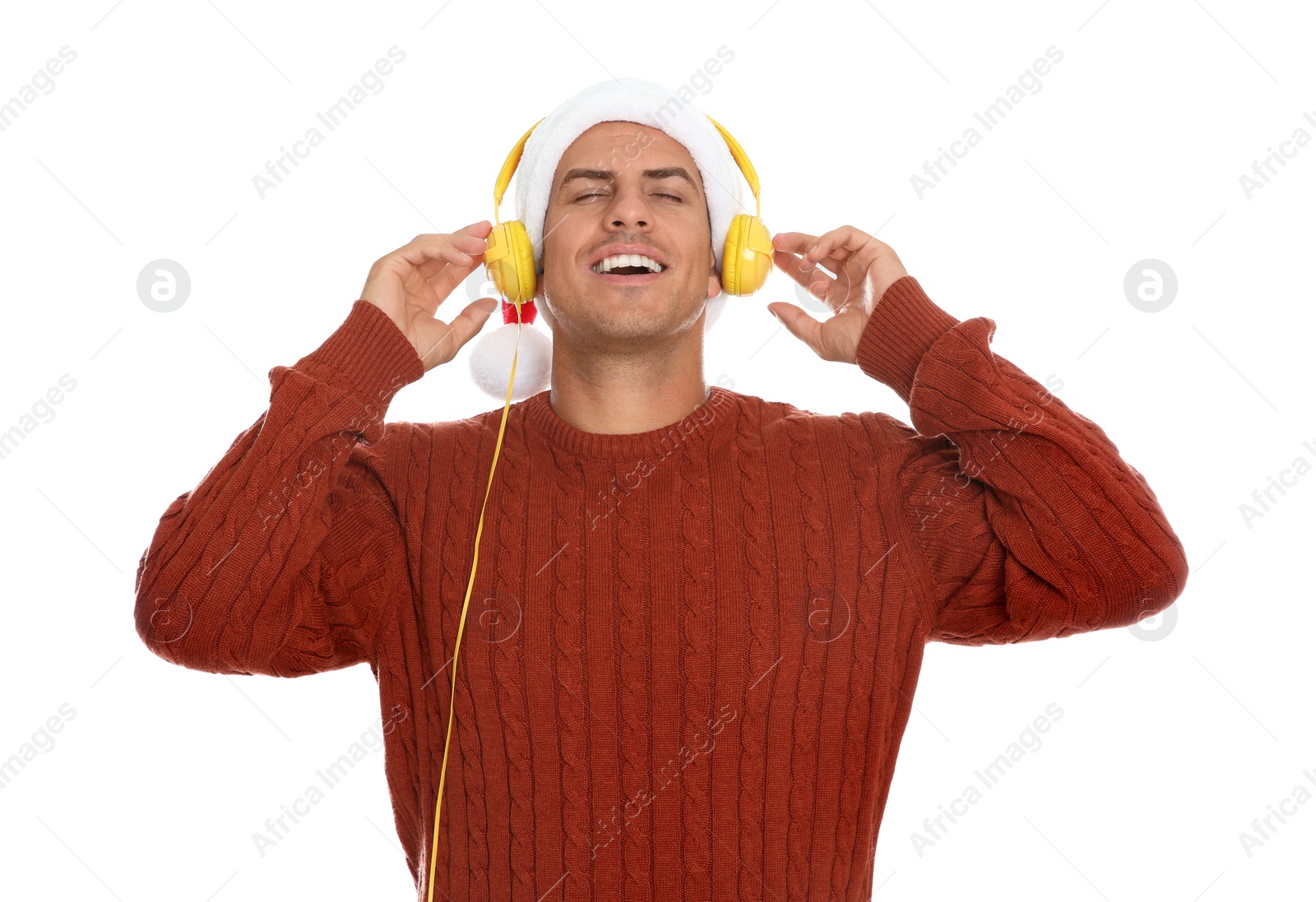 Photo of Emotional man with headphones on white background. Christmas music