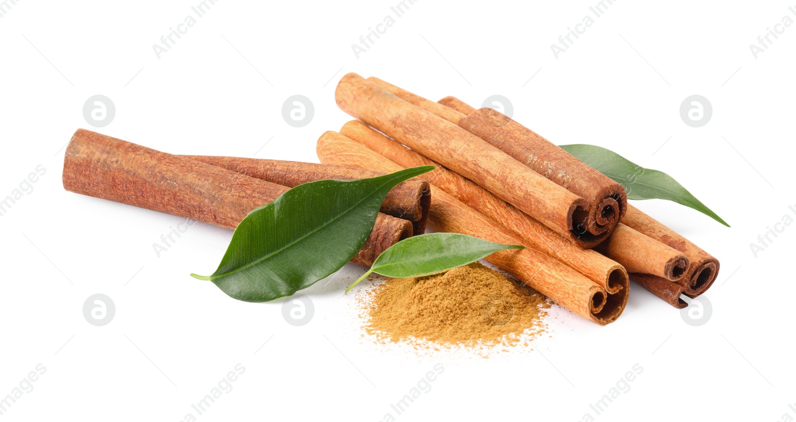 Photo of Dry aromatic cinnamon sticks, powder and green leaves isolated on white