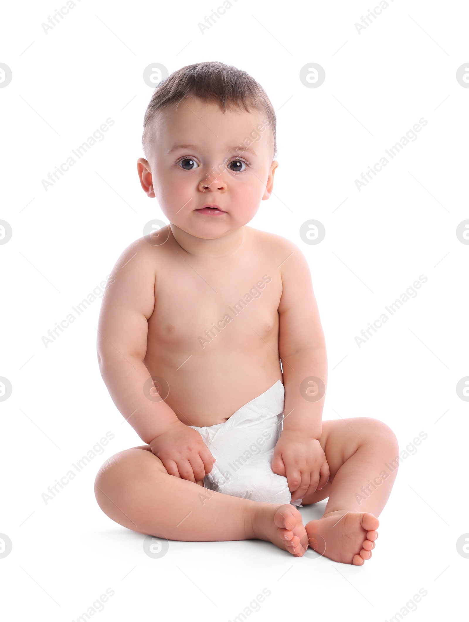 Photo of Cute baby in dry soft diaper sitting isolated on white